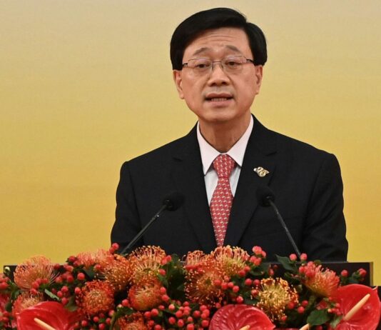China demands US invite Hong Kong leader to economic meeting, adding to strains over crackdown