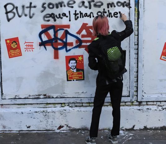 Chinese propaganda slogans turn London street art wall into a protest site against Beijing